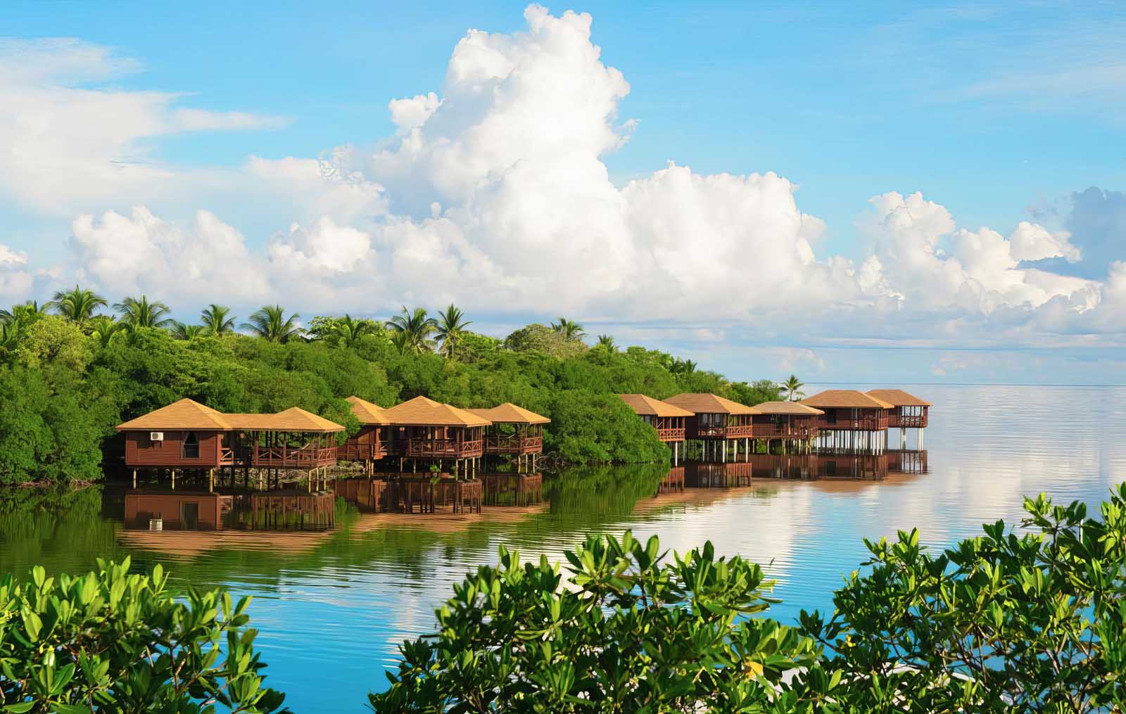 Overwater suite at Anthony’s Key Resort in Honduras with ocean-facing deck, popular for scuba diving access