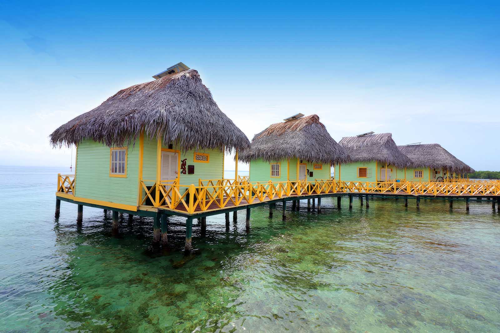 Solar-powered wooden overwater cabin in Bocas del Toro, Panama surrounded by clear Caribbean Sea