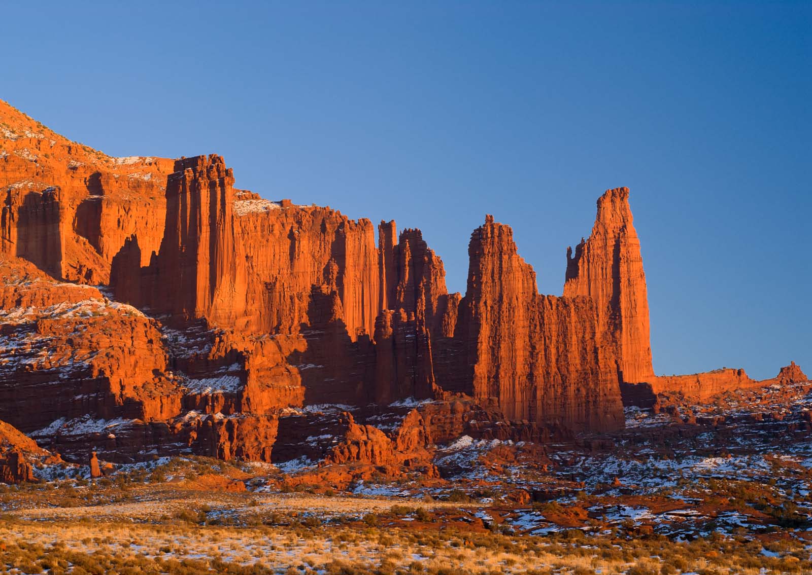 Fisher Towers Trail near Moab with tall red rock spires against a blue sky