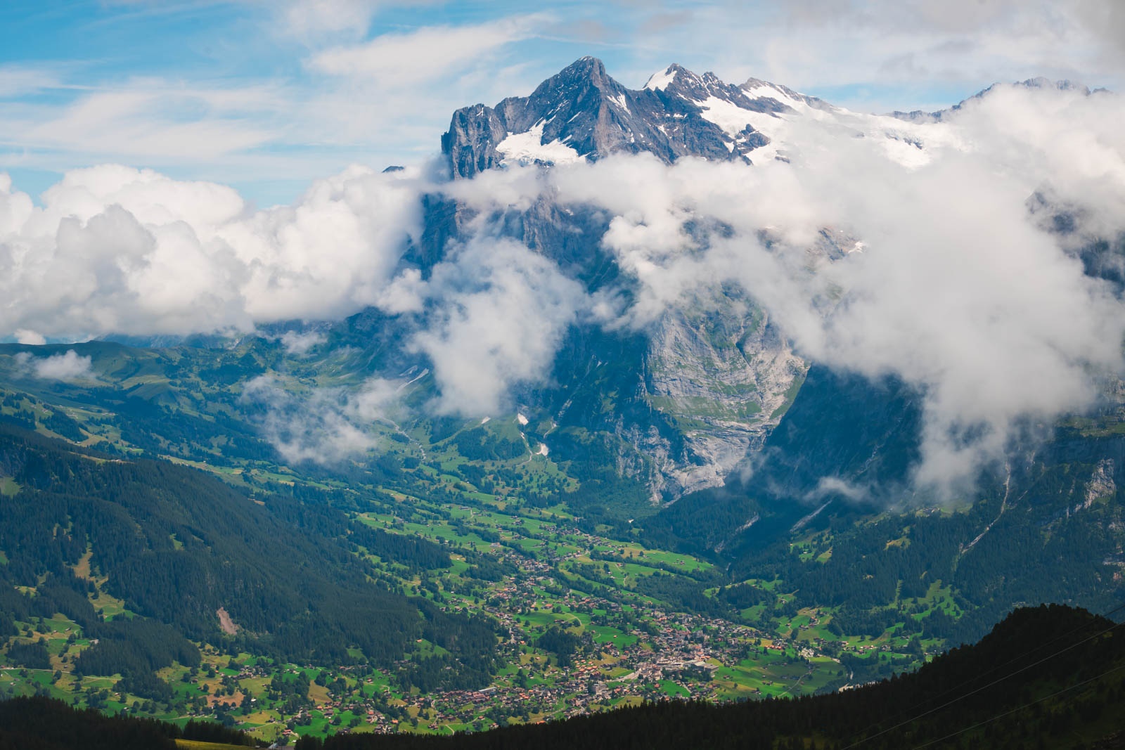 View of Lake Thun and Swiss Alps from Interlaken’s lakeside promenade