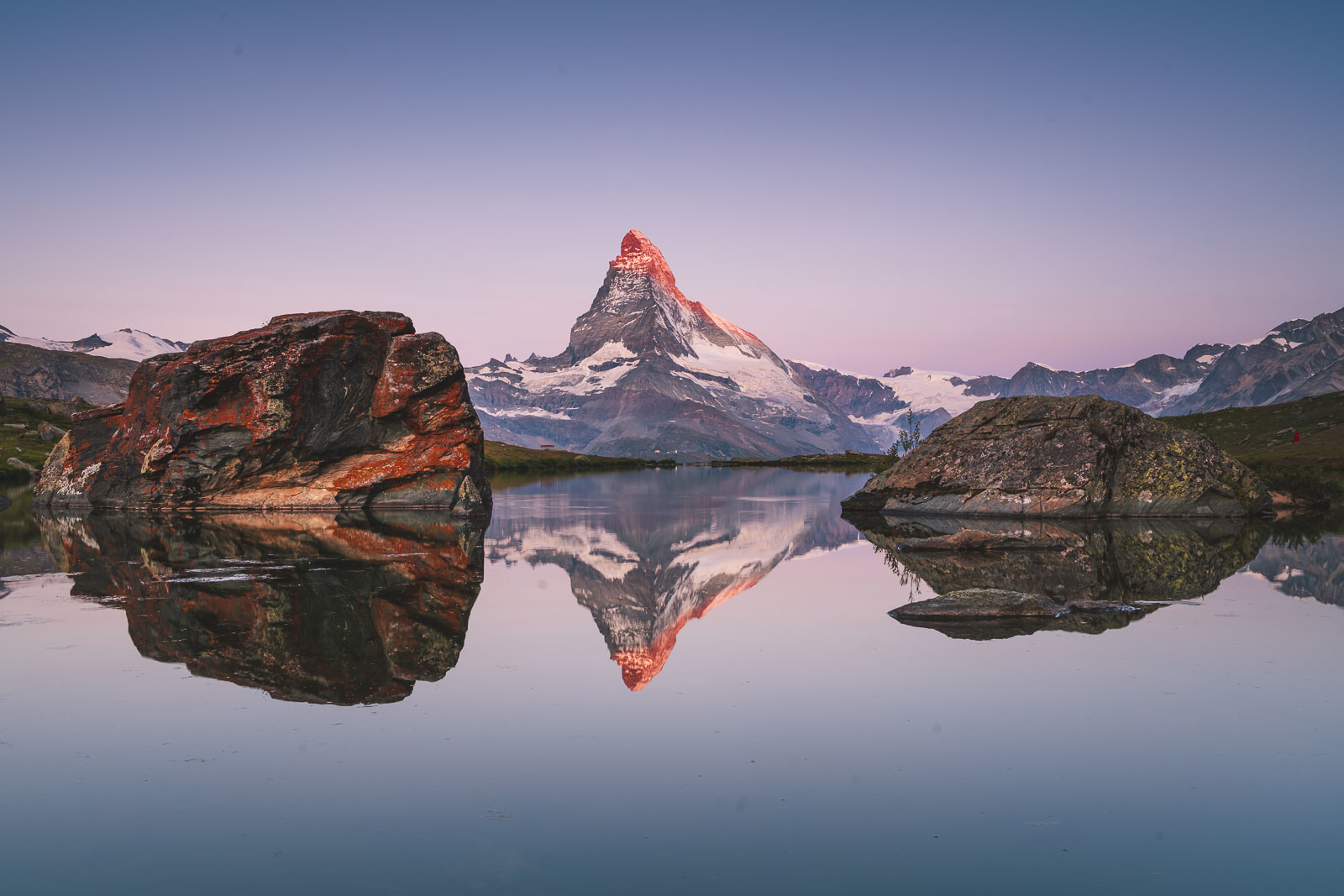 Sunrise over the Matterhorn reflected in alpine lake – Zermatt day trip must-see