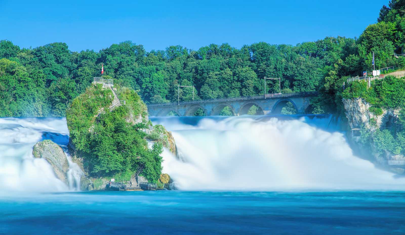 Powerful Rhine Falls near Schaffhausen with tourist boat and viewing platform