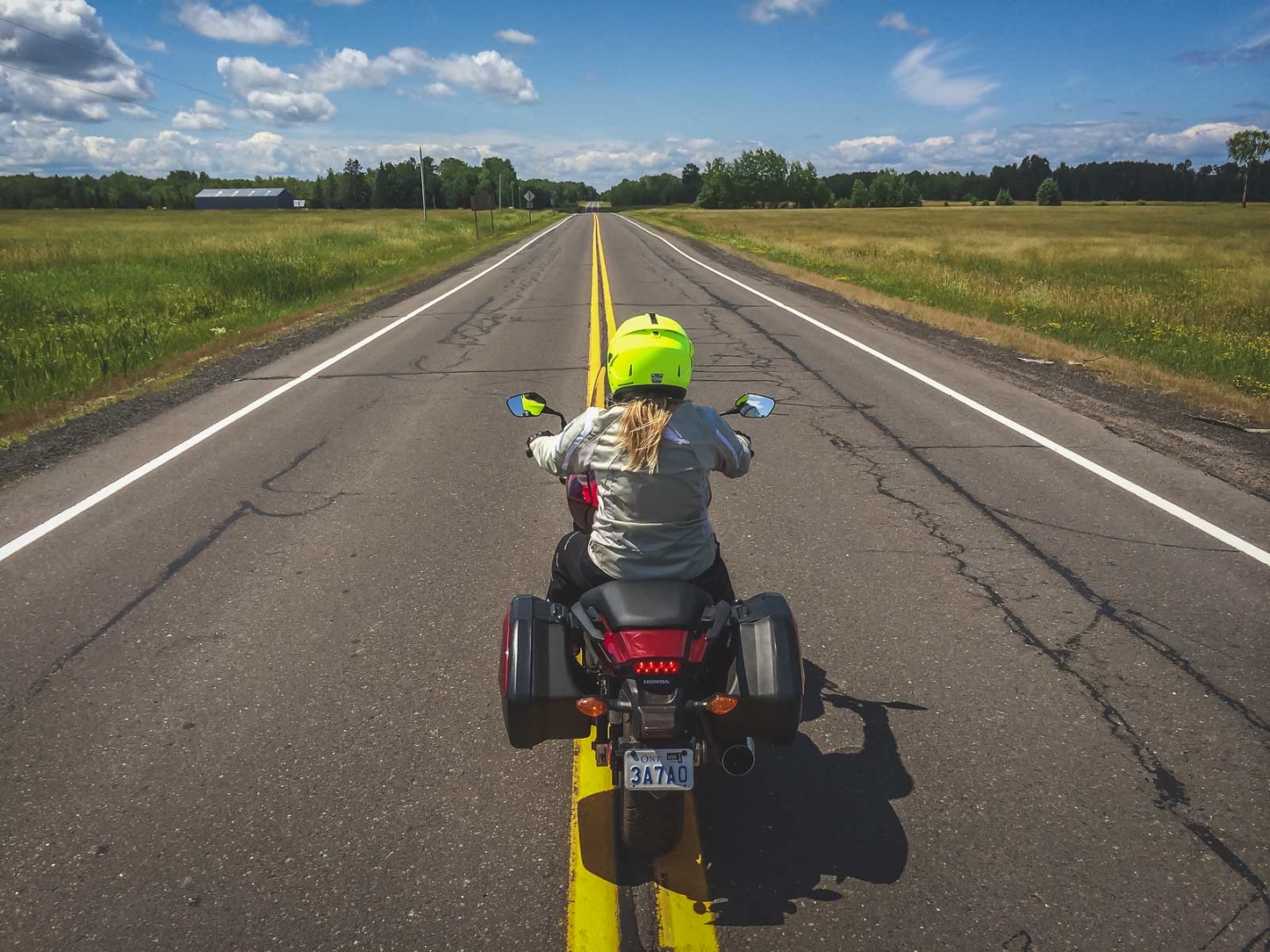 Deb on a motorcycle driving down the scenic US-2 highway in Lake Michigan in the Upper Peninsula.