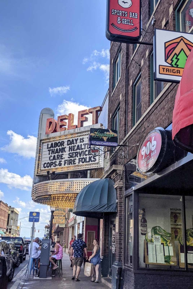 historic downtown marquette theatre against a blue sky, a must-see sight in this charming Upper Peninsula city