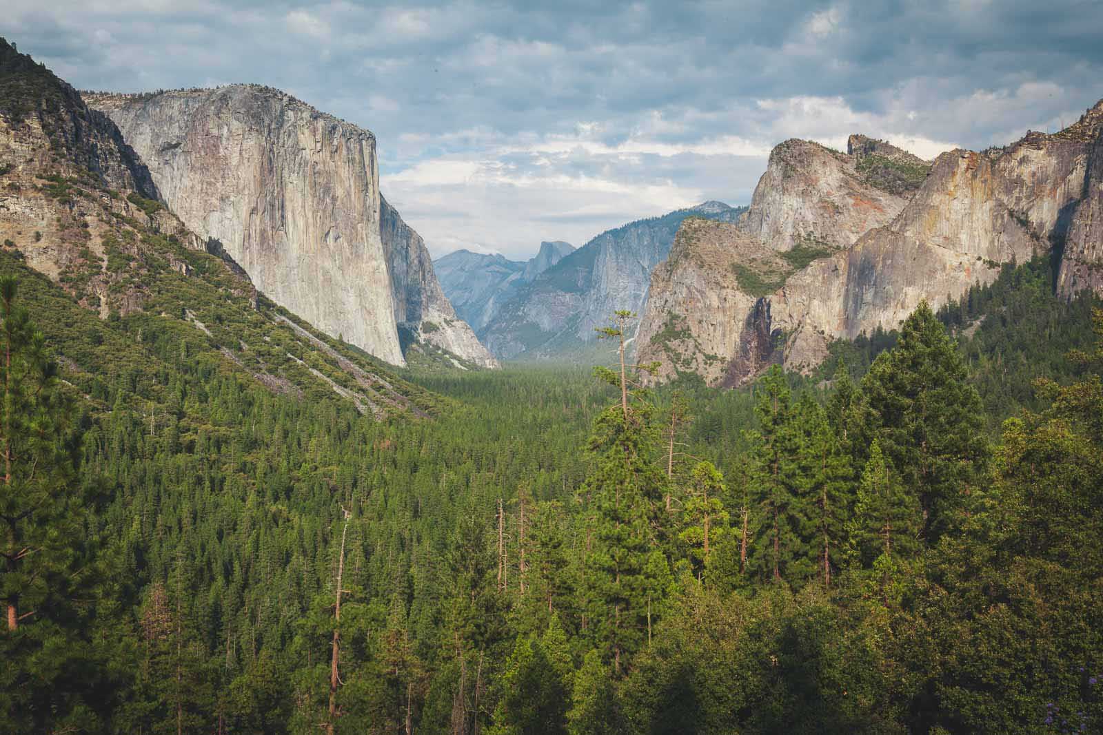 The iconic granite faces of El Capitan and Half Dome as seen from Tunnel View in Yosemite National Park.