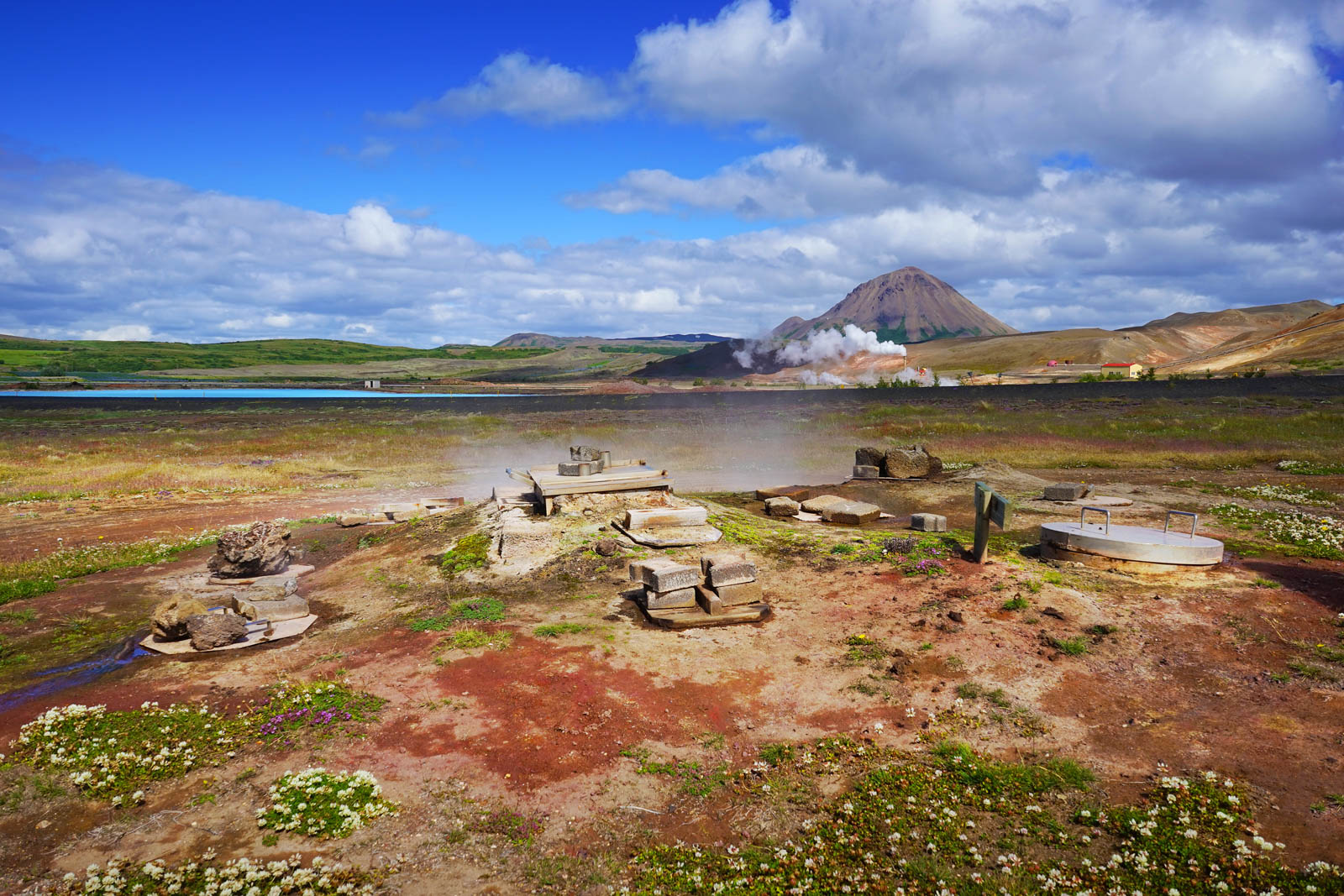 Freshly dug rúgbrauð rye bread steaming from geothermal baking at Laugarvatn Fontana.