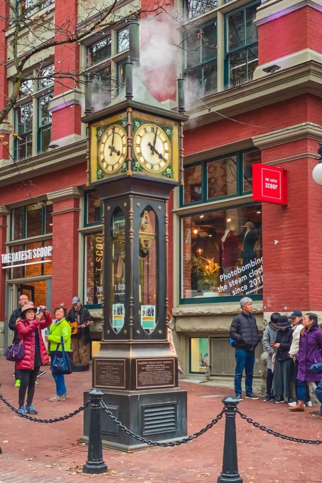 The historic Gastown Steam Clock on a cobblestone street in Vancouver's oldest neighbourhood.