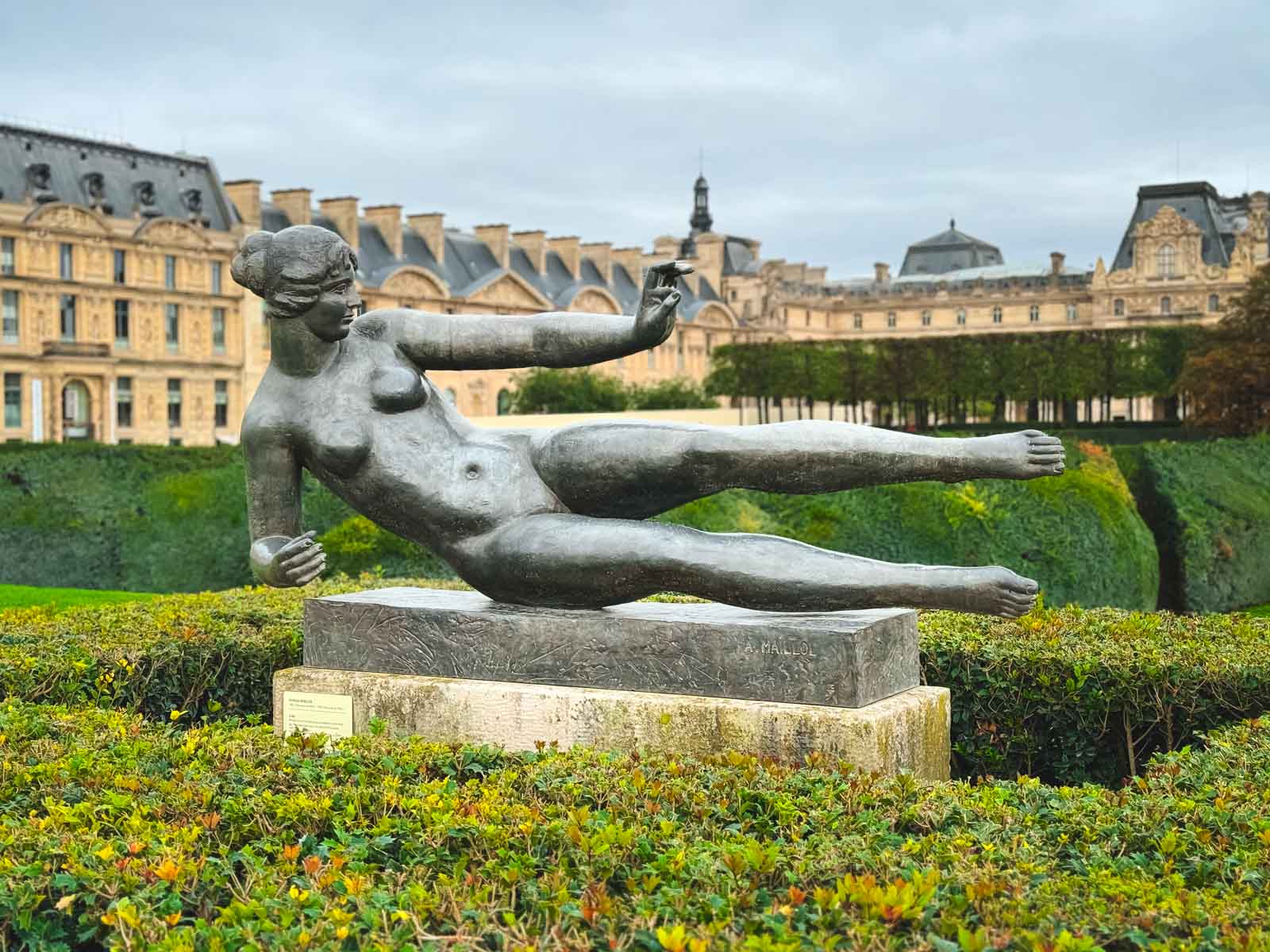 The Statue gardens with the Louvre Museum as seen from the beautiful Tuileries Garden in the 1st Arrondissement of Paris.