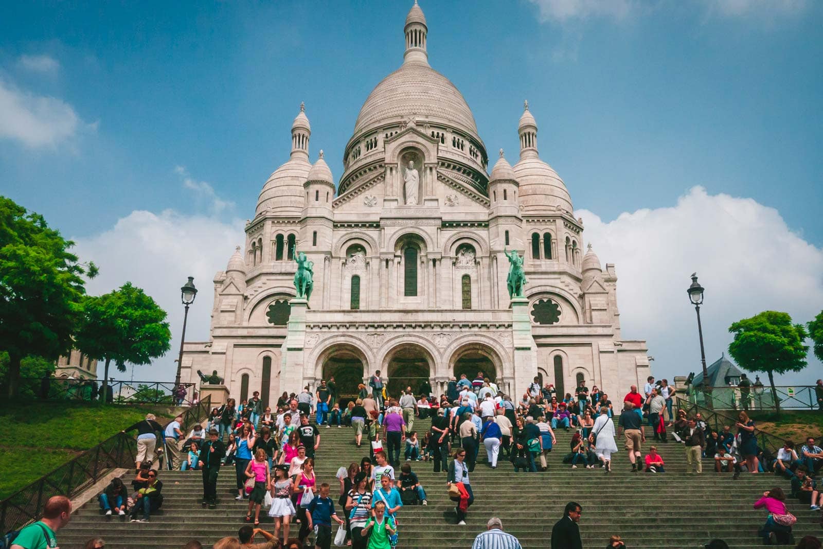The iconic view up the stars in Montmartre with the Sacré-Cœur Basilica visible at the top of the hill.