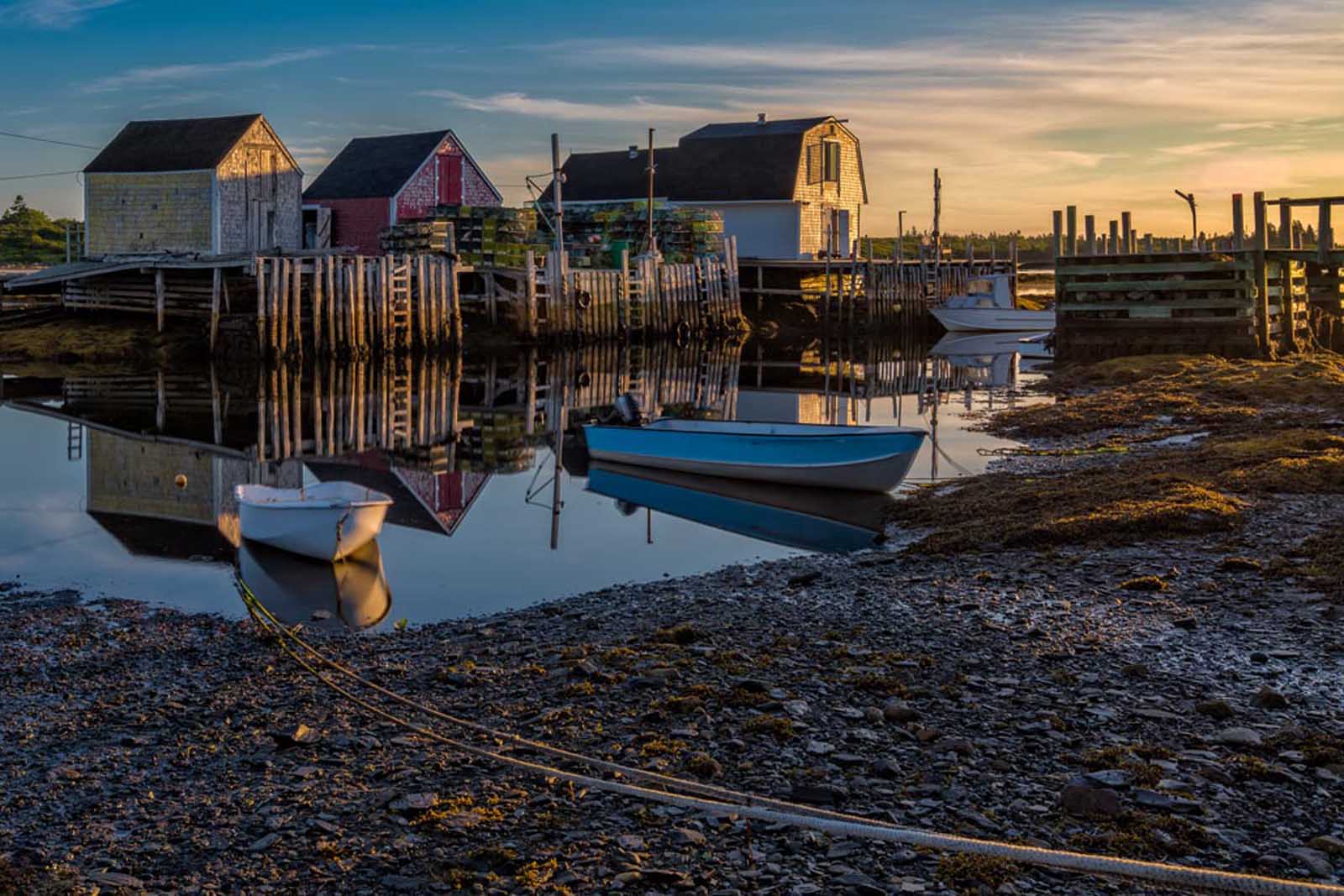 fishing shacks and rocky islands of Blue Rocks at sunrise.