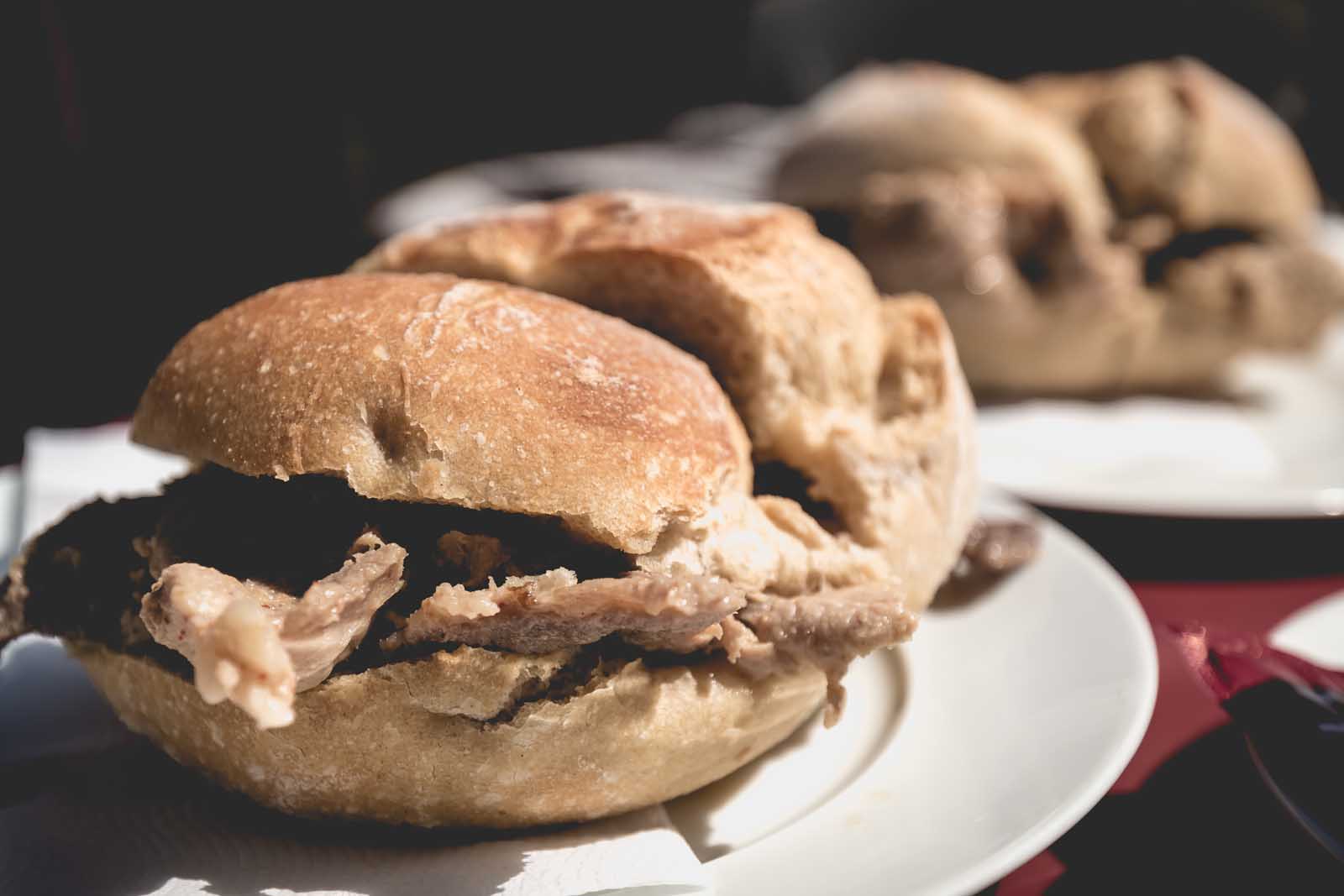 a delicious Bifana, a traditional Portuguese pork sandwich, from a local cafe in Porto.
