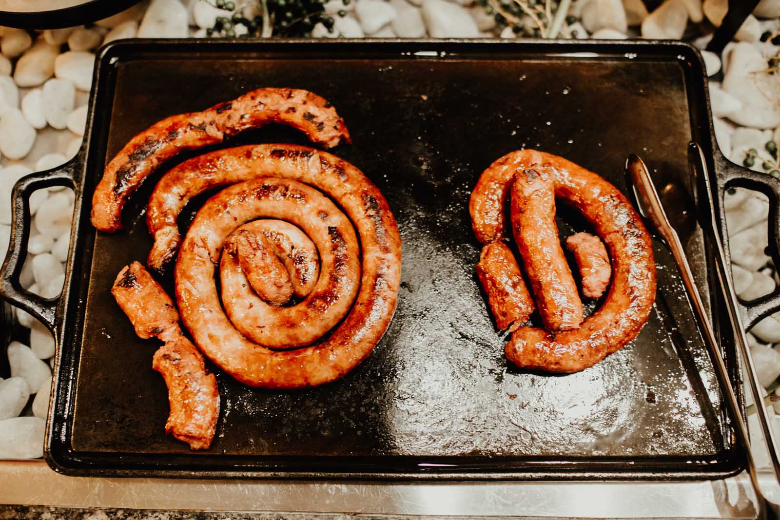 grilled Linguica, a smoky and spicy traditional Portuguese sausage.